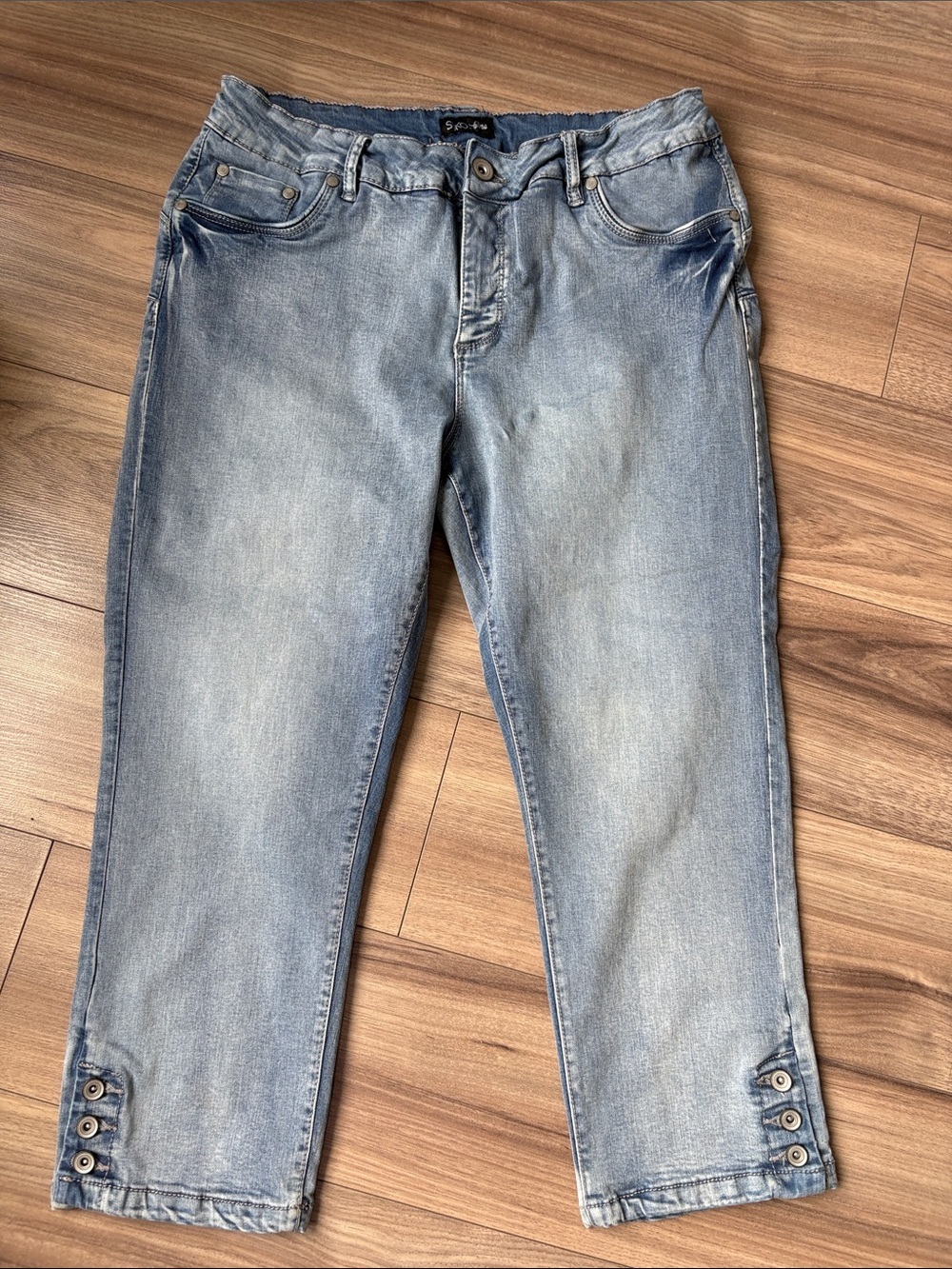 Women’s Light Blue Denim Capri Pants with Button Hem